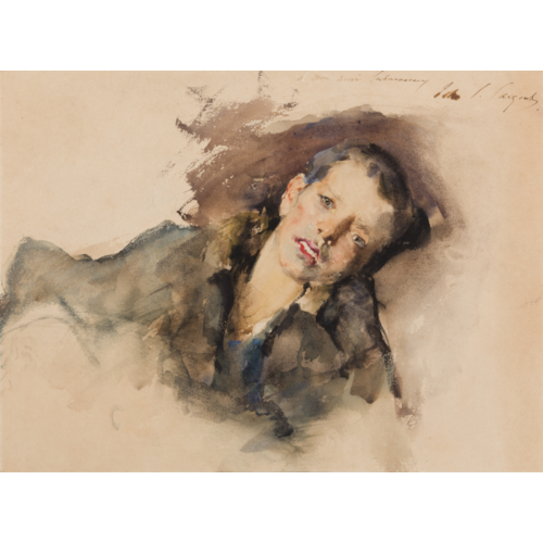 A Young Boy Lying on a Cushion